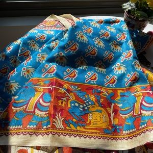 Silk saree from India, vibrant blue, gold, rust.